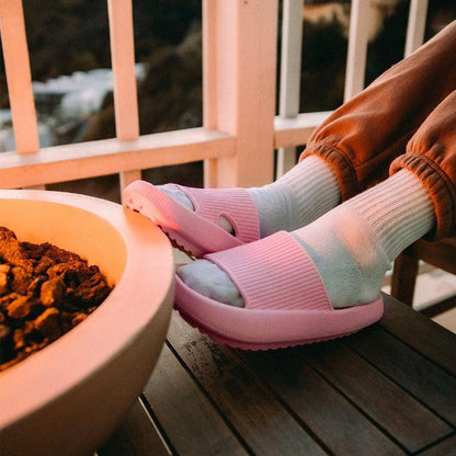 Cozy pink slides by campfire 